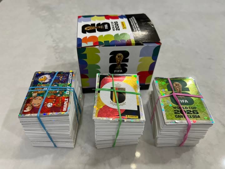 Panini FIFA World Cup 2026 sticker packs arranged with the official album